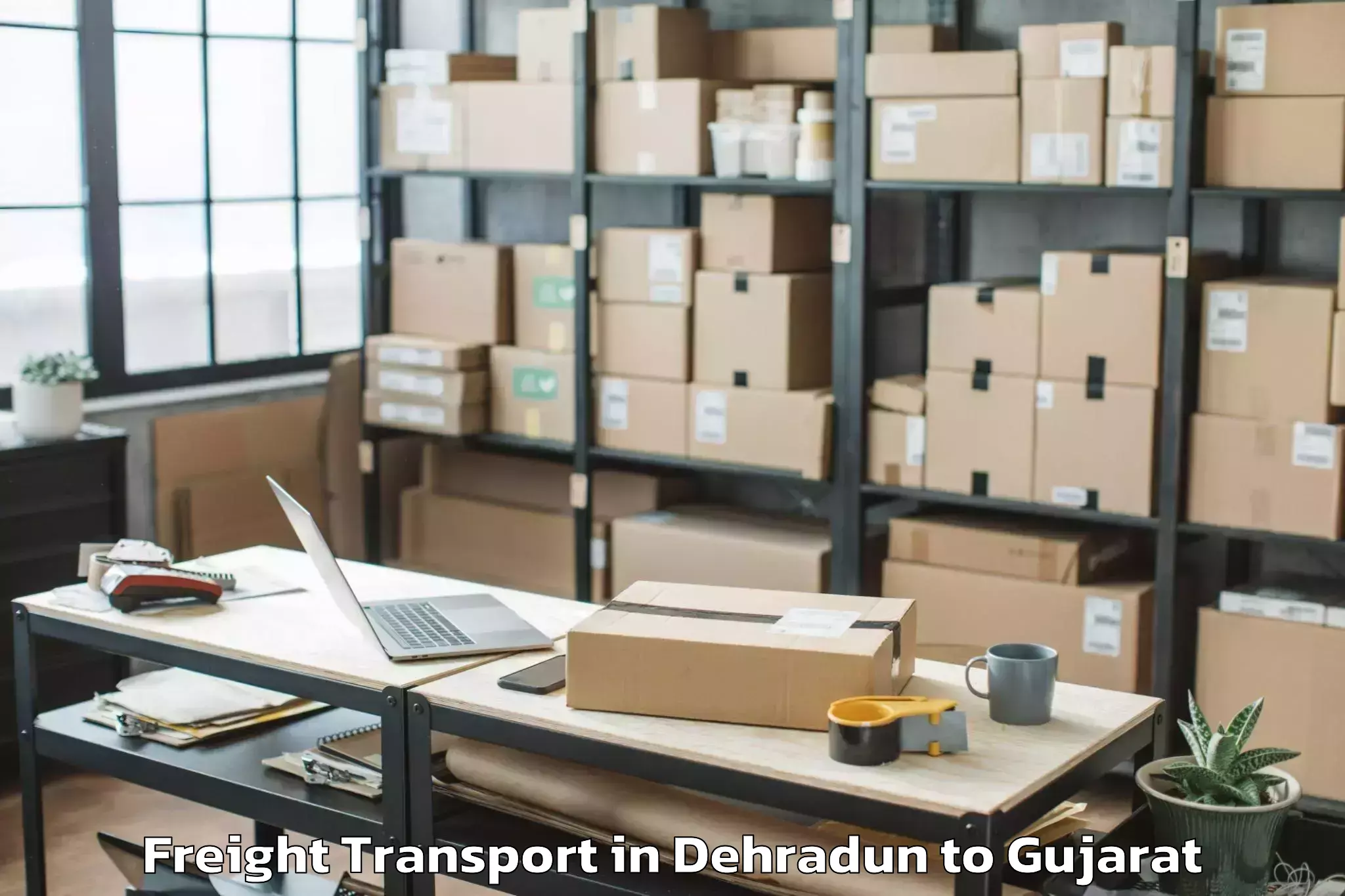 Professional Dehradun to Kadi Sarva Vishwavidyalaya Gan Freight Transport